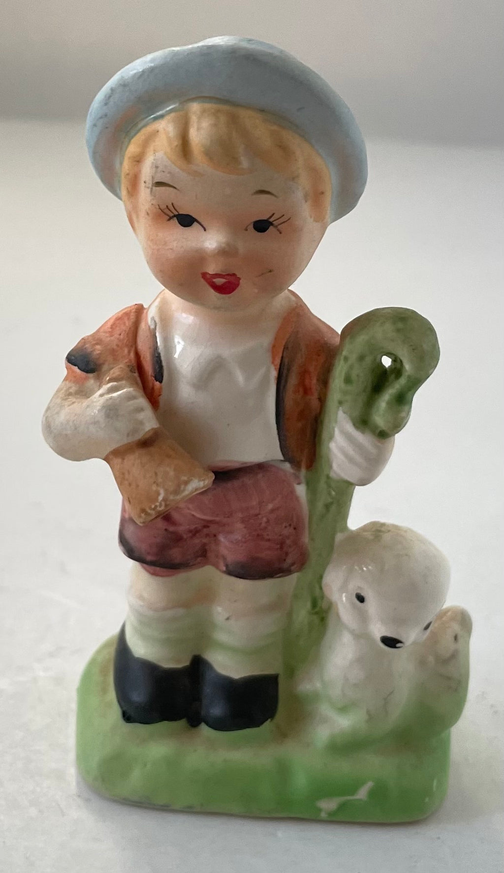 Shepherd boy with staff and lamb