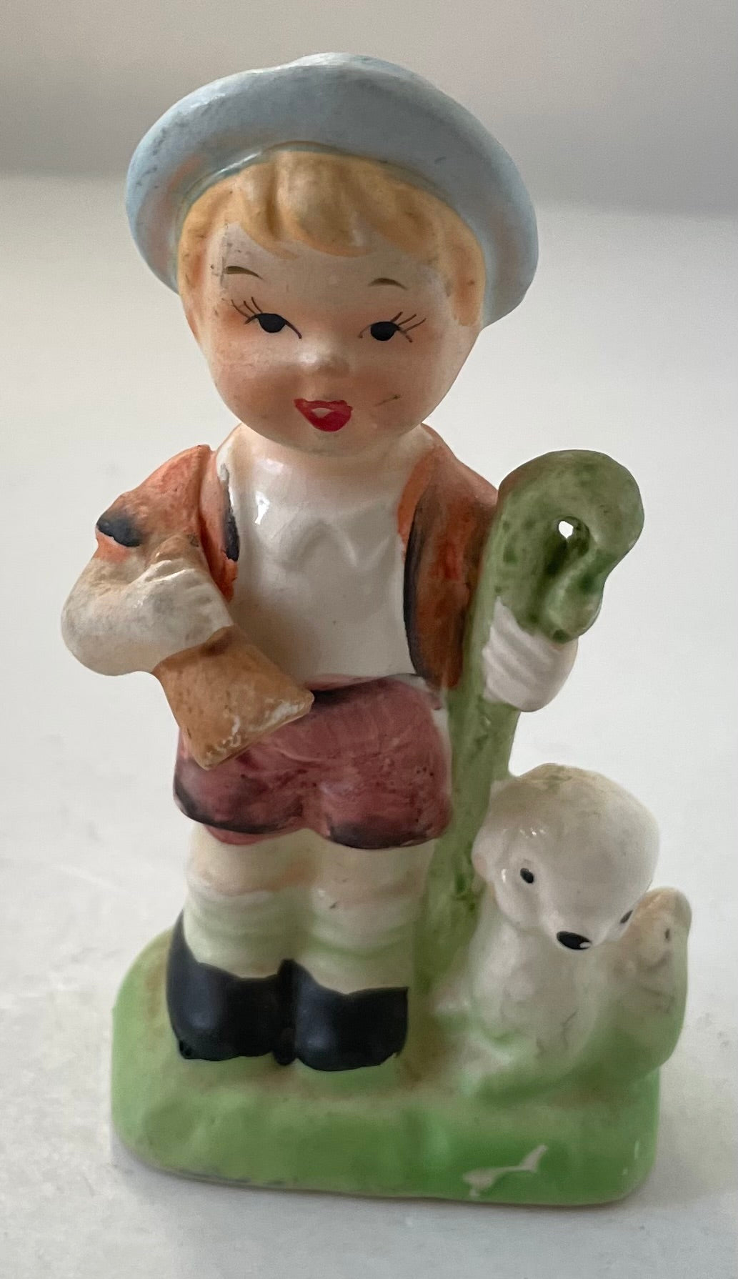 Shepherd boy with staff and lamb